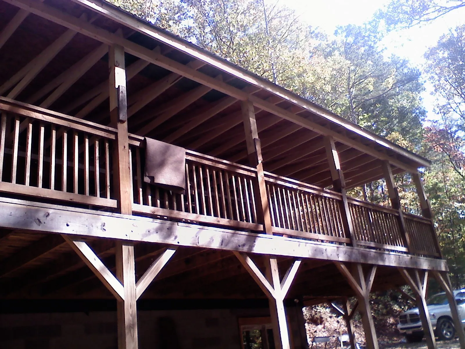 Timber framing under a new elevated porch and deck — Roof Leak Repair in Battery Park by Roofing Brothers